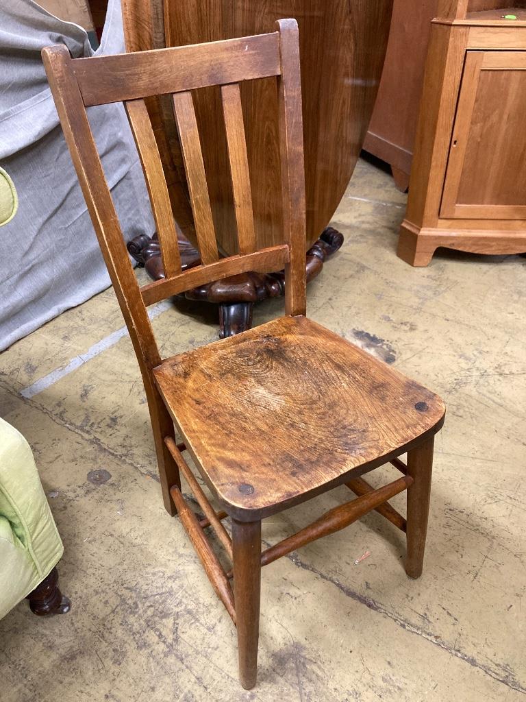 A set of six early 20th century beech chairs stamped 'Elliott & Son'
